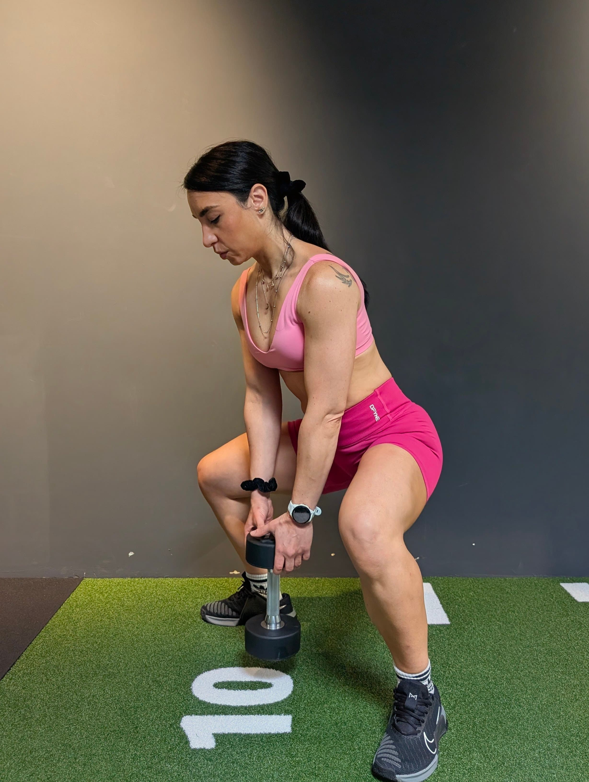 Roberta Virzi smiling with dumbbells